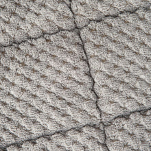 Gray textured knit pet bed mat surface with raised tufted pattern.