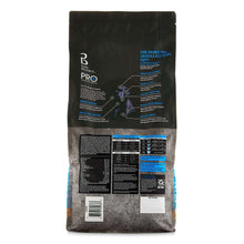 Back label of Pure Balance PR+ puppy chicken and rice dry dog food bag with tables