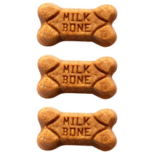Mini bone-shaped dog treats, three brown pieces stamped with Milk-Bone