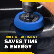 Drill-mounted blue foam polishing pad on a car surface with spinning drill head