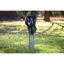Black quad folding camp chair folded with fabric back and seat, for storage