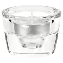 Clear glass candleholder with wide rim and tealight/taper opening