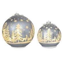Set of two gold glass Christmas ornaments with tree, deer, and star details