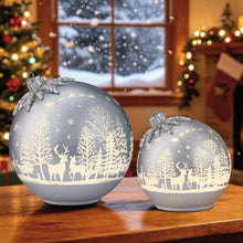 Set of two silver glass Christmas ornaments with deer and tree scene
