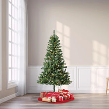 Pre-lit artificial Christmas tree with green branches and warm color-changing LED lights