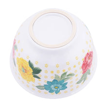 White melamine mixing bowl with beige rim and yellow, pink, and blue floral print