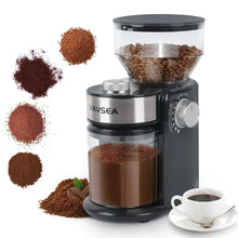 VAVSEA electric burr coffee grinder with ground coffee piles and cup on counter