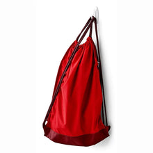 Command medium hook holding red drawstring bag with black cords