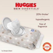 Huggies Skin Essentials wipes pack with a white wipe pulled from the lid