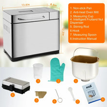 Stainless steel bread maker with top controls and included measuring cup, spoon, mitt