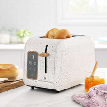 2-slice digital toaster with linen speckle finish and bread in the slots