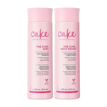 Curly hair shampoo and conditioner bottles, two pink bottles with labels