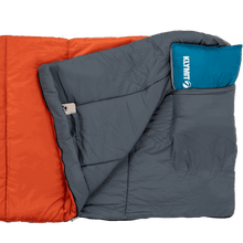 Adult sleeping bag with dark gray body and blue hood patch, padded baffles