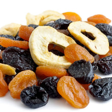 Dried mixed fruit pieces, including apples, apricots, plums, and raisins.