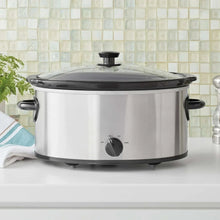 6 qt manual slow cooker with clear glass lid, black handles, stainless exterior