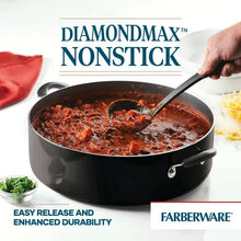 Black nonstick family pan with handles and visible cooked food