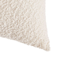 Ivory boucle square pillow corner edge with soft textured fabric