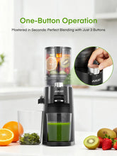 Black cold press juicer with one-button control, jar beneath spout with green juice.