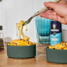 Thyme green stoneware ramekin set with wooden spoon and cheesy casserole