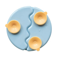 Light blue divided suction plate underside with three suction cups