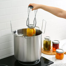 Stainless steel canner pot with rack lifting filled jars for water bath canning