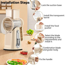 Beige rotary cheese grater showing suction base, transparent barrel, and blade installation