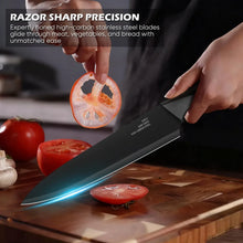 Chef knife slicing vegetables on a wooden cutting board
