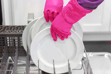 Magenta rubber cleaning glove lifting a bowl in the sink