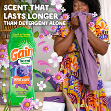 Green Gain scent booster bottle with purple moonlight breeze theme on front panel.