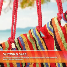 Hanging hammock chair with thick red ropes and multicolor striped weave fabric