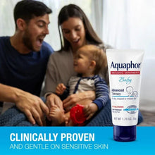 Aquaphor Baby Healing Ointment tube beside an infant during use