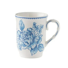 Blue floral stoneware mug with scalloped rim and handle, front view