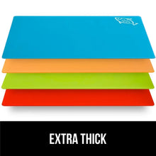 Stacked four-piece multicolor flexible plastic cutting boards in blue, orange, green, and red