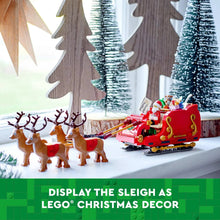 Santa's sleigh display with red sleigh, Santa figure, and brown reindeer by trees