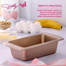 Rose-gold loaf pan with butterfly stamp, shown with eggs and banana nearby