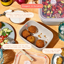 Taupe stoneware bake and store dishes with vented lids, holding prepared food