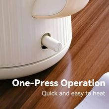 Cream electric kettle underside showing power base opening