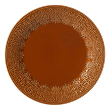 Caramel ceramic dinner plate top view with raised lace border around center