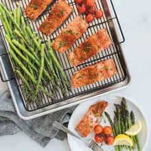 Extra-large oven crisping tray with wire rack, holding asparagus and roasted fish sticks.
