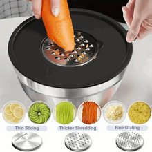 Stainless steel mixing bowl with black lid and mounted grater, slicing vegetables