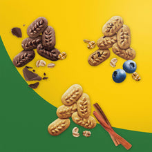 Chocolate, blueberry, and cinnamon snack biscuits arranged on yellow and green backdrop
