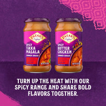 Two spicy simmer sauce bottles with purple labels on a promotional graphic
