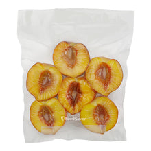 Vacuum-sealed bag filled with peach slices, flat and clear through the bag
