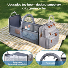 Grey diaper backpack with foldable playpen crib and detachable sunshade mosquito net.