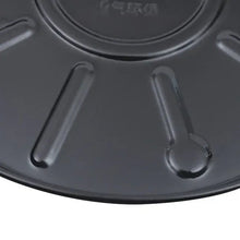 Close-up of embossed design on a black round plant caddy with wheel supports