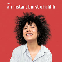 Smiling person with curly hair in an air freshener promotional scene