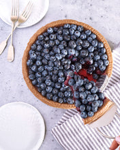 Blueberry-topped pie filling on a round crust