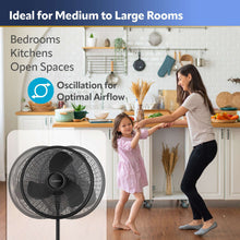 Black oscillating pedestal fan with circular grille on standing base