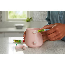 Precision tip glue being applied to a ceramic cup