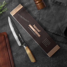 Damascus chef knife with wooden handle, shown with branded gift box and blade close-up.